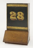 Lot 82 - A Victorian toleware and walnut-mounted shop tea canister