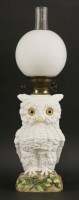 Lot 61 - A large German porcelain novelty oil lamp