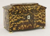 Lot 75 - A George III serpentine-fronted tortoiseshell tea caddy