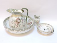 Lot 135 - A Royal Doulton jug and basin