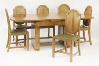 Lot 132 - An Art Deco walnut dining room suite