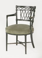 Lot 76 - An ebonised armchair