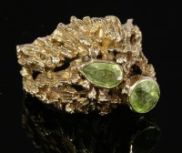 Lot 41 - A 9ct gold two-stone peridot ring
