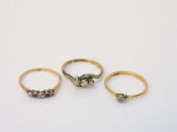 Lot 249A - A three stone diamond crossover ring