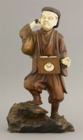 Lot 376 - A wood and ivory Figure