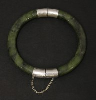 Lot 524 - A spinach jade bangle