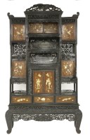 Lot 421 - A carved blackwood Display Cabinet