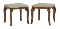 Lot 1589 - A pair of walnut stools