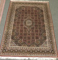 Lot 1573 - A Persian rug