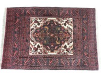 Lot 1569 - Three small Persian red ground mats