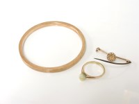 Lot 1047 - A 9ct gold hollow bangle