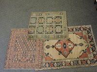 Lot 1580 - A Caucasian ivory ground rug