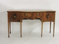 Lot 1585 - A George III mahogany and crossbanded serpentine front sideboard