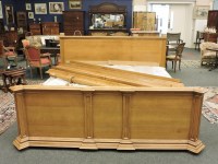 Lot 1557 - An oak emperor size bed