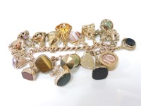Lot 1033 - A 9ct gold curb link watch chain and padlock
