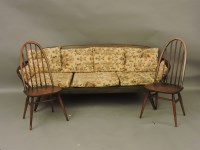 Lot 1546 - An Ercol dark stained settee
