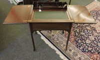 Lot 1628 - An Edwardian rise and fall writing table