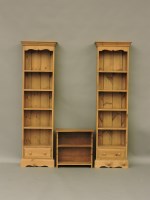 Lot 1588 - A pair of modern pine narrow bookcases