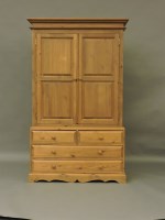 Lot 1606 - A modern stripped pine linen press