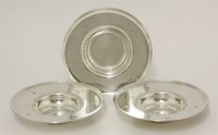 Lot 211 - A set of three silver dishes 
by Gerald Benney