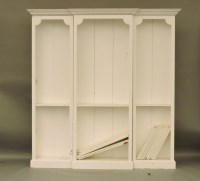 Lot 1533 - An Edwardian later white painted breakfront open bookcase