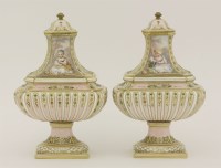 Lot 20 - A pair of pierced porcelain pot pourri and covers