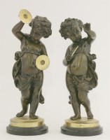 Lot 84 - A pair of bronze putti