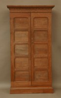 Lot 694 - A 20th century oak cupboard