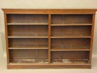 Lot 798 - A walnut two section open bookcase