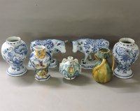 Lot 447 - A pair of Dutch pottery blue and white cow ornaments