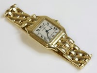 Lot 527 - A gentlemen's 18ct gold Cartier Panther quartz bracelet watch