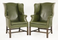 Lot 405 - A pair of wingback armchairs