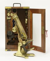 Lot 39 - A lacquered brass monocular microscope