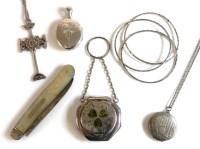 Lot 79 - A silver decorative cross on chain