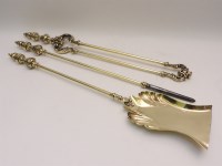 Lot 371 - A set of brass fire throws