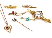 Lot 53 - A gold diamond and turquoise 'forget me not' bar brooch