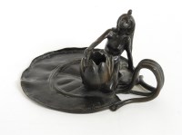 Lot 185 - An Art Nouveau patinated bronze chamberstick