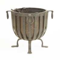 Lot 43 - An Arts & Crafts iron log bin