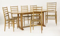 Lot 73 - An oak refectory table and five rush-seated chairs