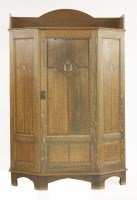 Lot 48 - An Arts and Crafts oak wardrobe