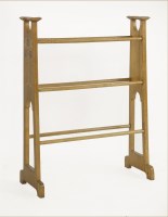 Lot 77 - An Arts and Crafts oak towel rail