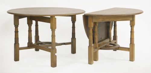 Lot 85 - A pair of Arts and Crafts oak gateleg tables