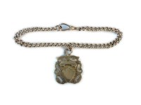 Lot 21 - A 9ct gold guard chain bracelet with 9ct gold fob with vacant cartouche