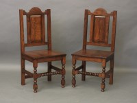 Lot 733 - A pair of oak solid seat chairs
