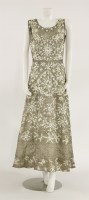 Lot 1186 - A metallic gold sleeveless evening dress