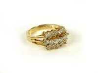 Lot 65A - A gold three row diamond cluster ring
