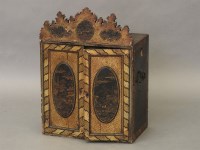 Lot 601 - A lacquered table cabinet