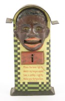 Lot 235 - A tin plate negro money box