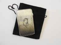 Lot 104 - A Russian silver cigarette case with flinted detail and a monogrammed centre