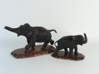 Lot 286 - A Meiji period bronze of a running elephant